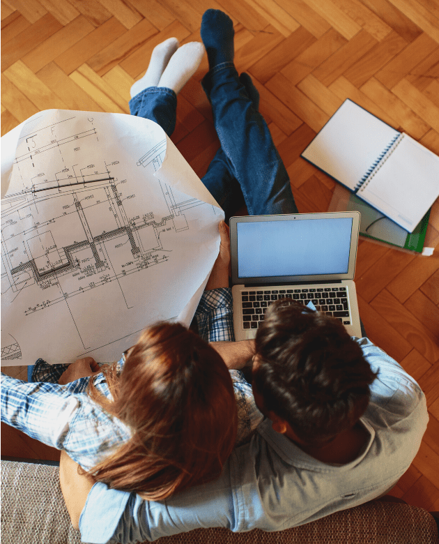 couple assessing construction plans